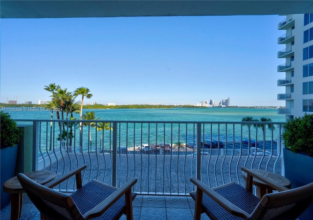 balcony featuring a water view