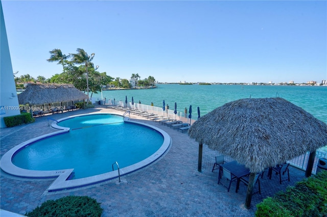 view of swimming pool with a gazebo, a water view, and a patio