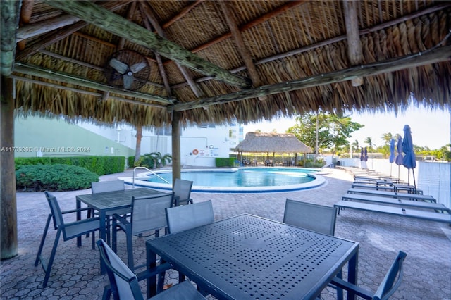 view of swimming pool featuring a gazebo and a patio