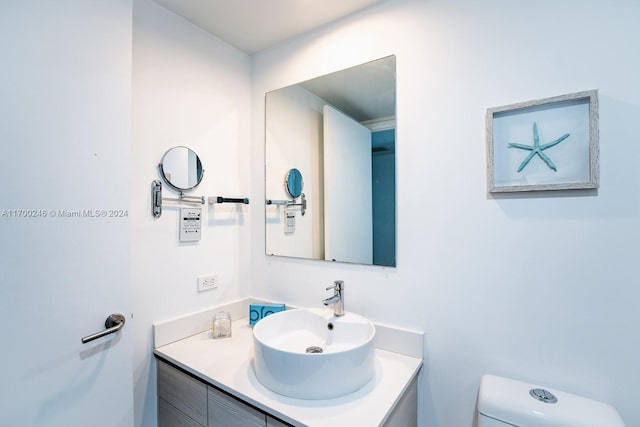 bathroom with vanity and toilet