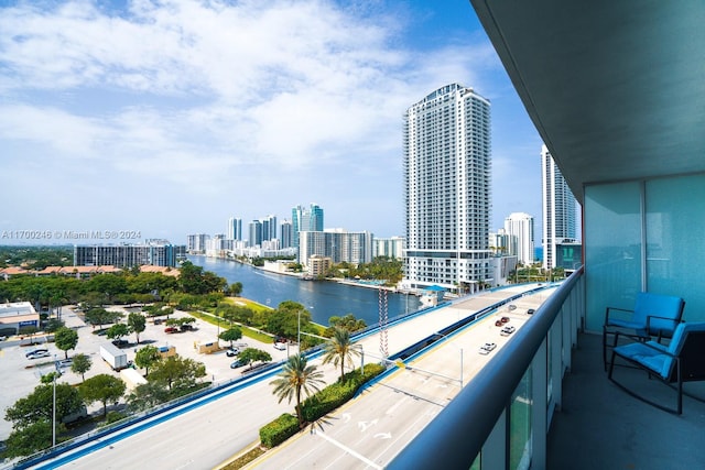 balcony featuring a water view