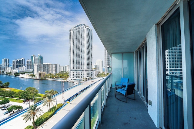 balcony featuring a water view