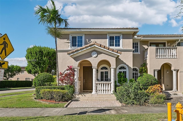 mediterranean / spanish-style house with a balcony