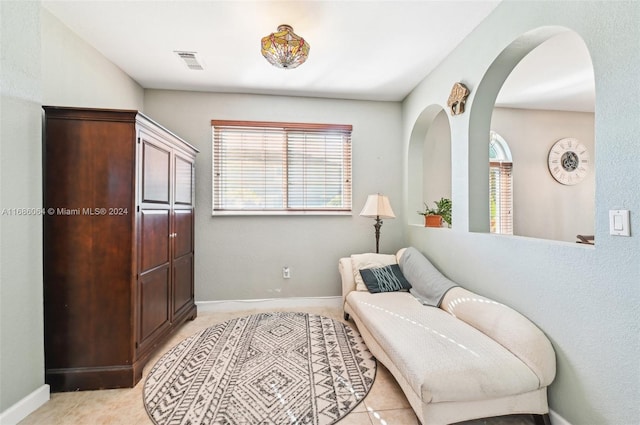 living area with light tile patterned floors