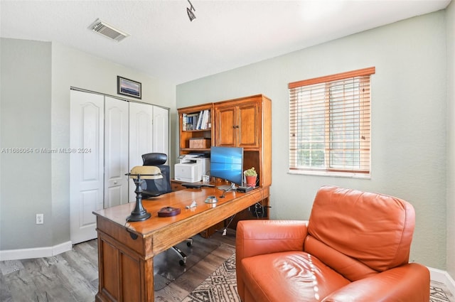 office area with light wood-type flooring