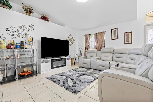 living room with light tile patterned floors and high vaulted ceiling