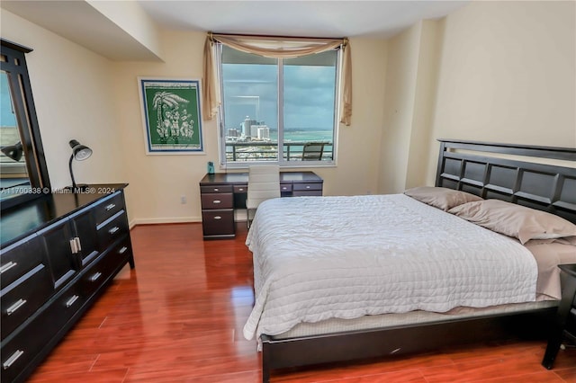 bedroom featuring dark hardwood / wood-style flooring