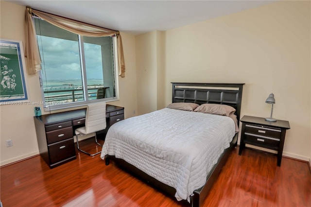 bedroom featuring dark wood-type flooring