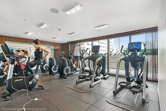 exercise room featuring wooden walls