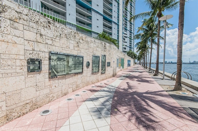 view of home's community with a water view