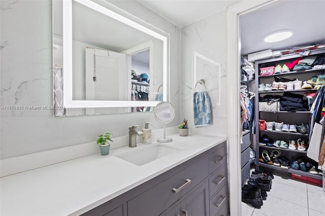 bathroom with tile patterned flooring and vanity