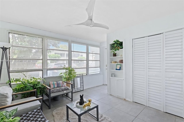 interior space featuring ceiling fan and light tile patterned flooring