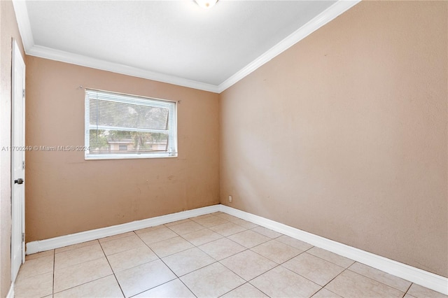 tiled empty room with crown molding