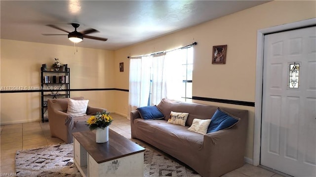 living room with light tile patterned floors and ceiling fan