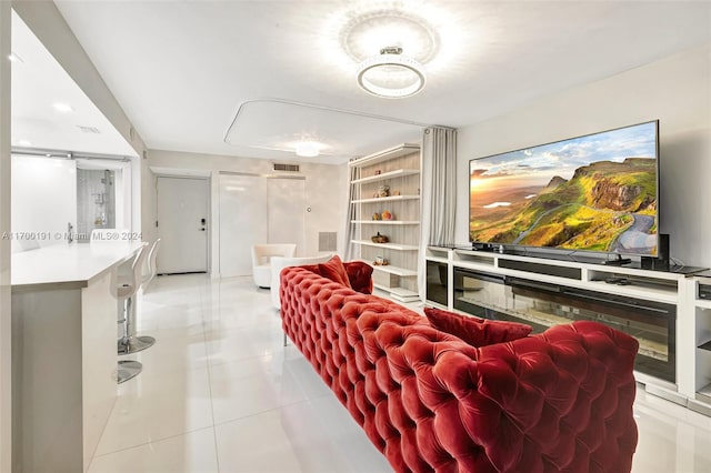 cinema room featuring light tile patterned floors