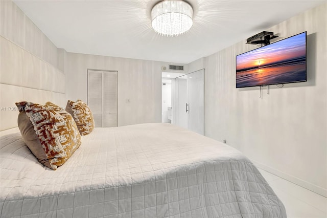 bedroom featuring a chandelier