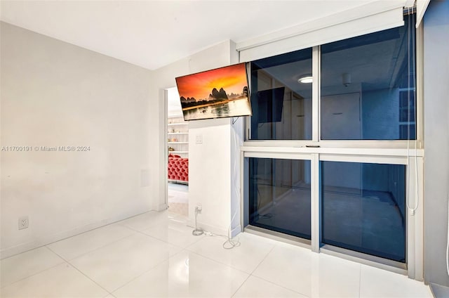 spare room with tile patterned floors