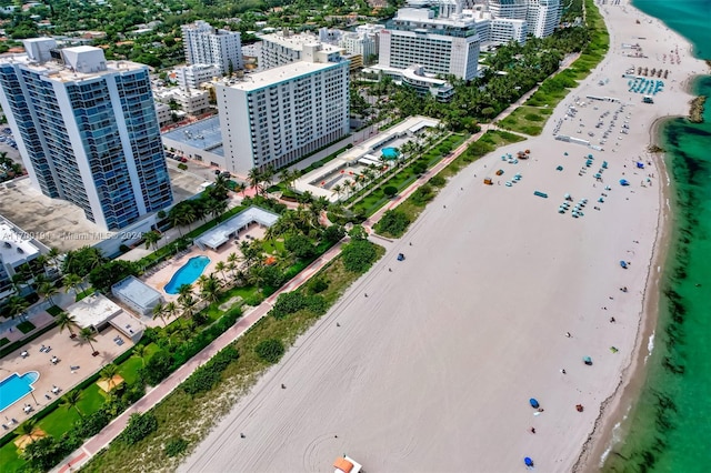 birds eye view of property featuring a view of the beach and a water view