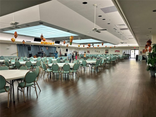 dining room featuring ceiling fan and dark hardwood / wood-style floors