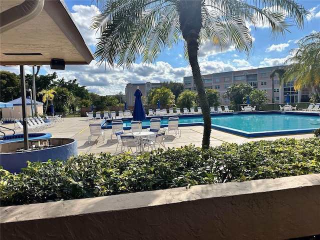 view of swimming pool with a patio