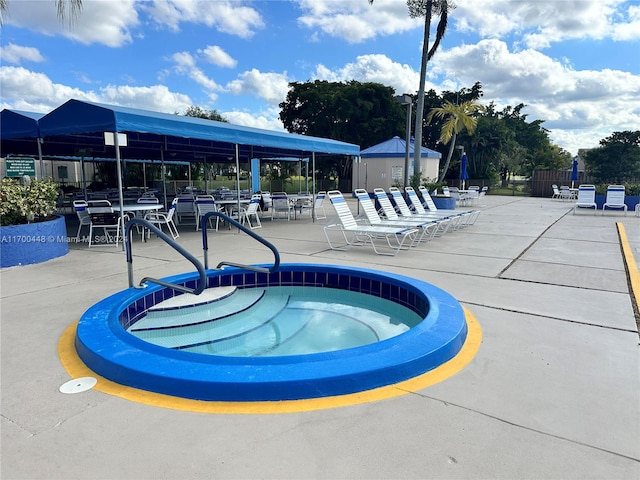 view of pool with a community hot tub