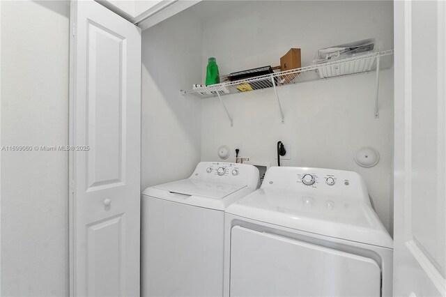 laundry room with washer and dryer