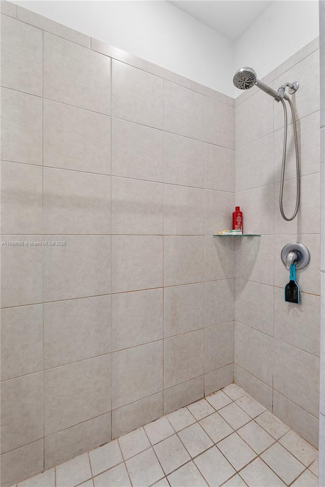 bathroom with tiled shower