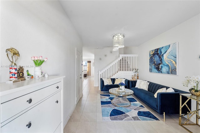 living room featuring light tile patterned flooring and an inviting chandelier