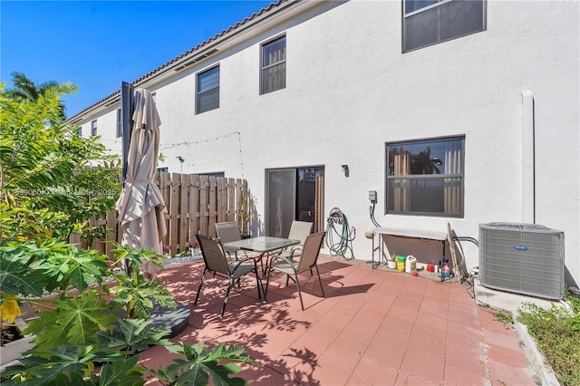 back of house with a patio and cooling unit