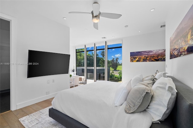 bedroom with ceiling fan, access to exterior, and light hardwood / wood-style flooring