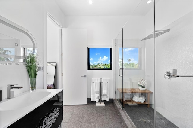 bathroom featuring hardwood / wood-style floors, vanity, and an enclosed shower