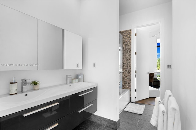 bathroom featuring shower / bathing tub combination, vanity, and tile patterned floors