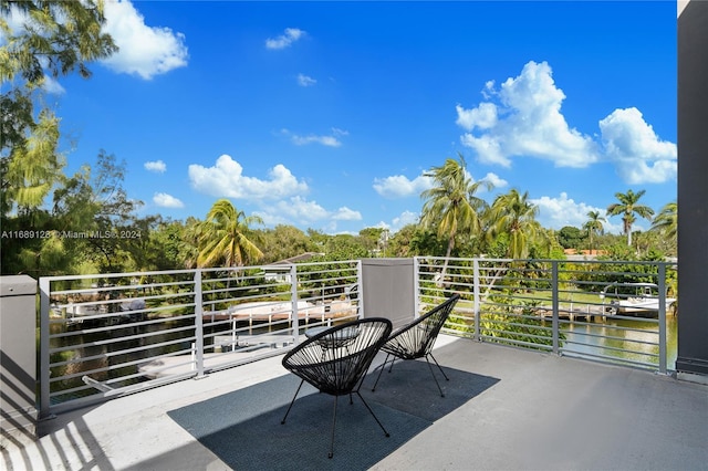 balcony featuring a water view