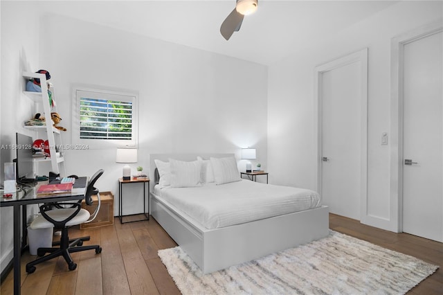 bedroom featuring hardwood / wood-style flooring and ceiling fan