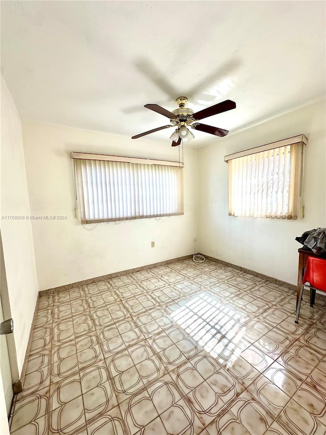 unfurnished room featuring ceiling fan