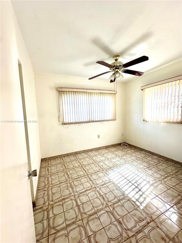 spare room featuring ceiling fan