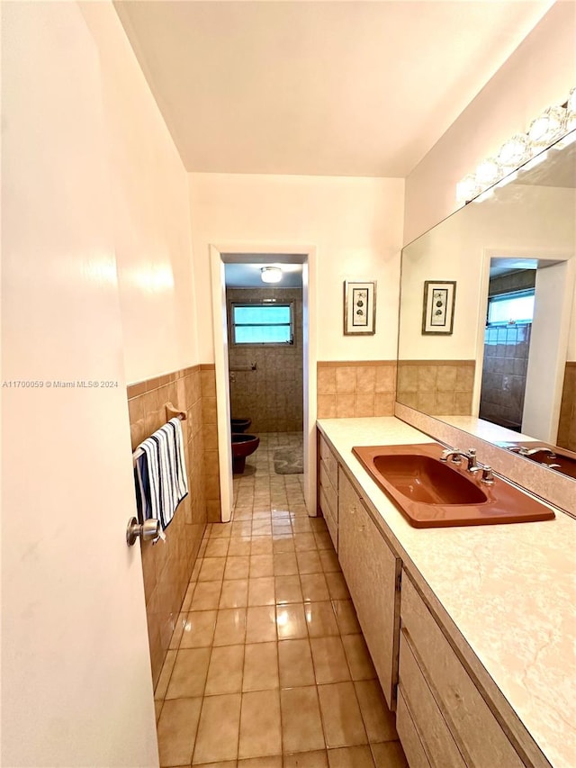 bathroom with tile patterned flooring, a shower, toilet, vanity, and tile walls