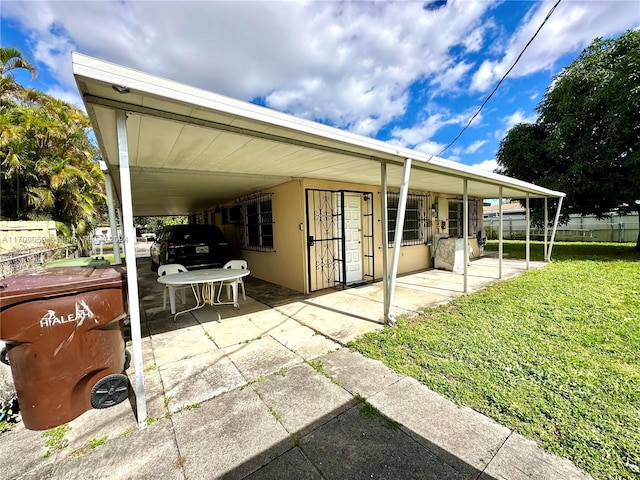 view of patio / terrace with a carport