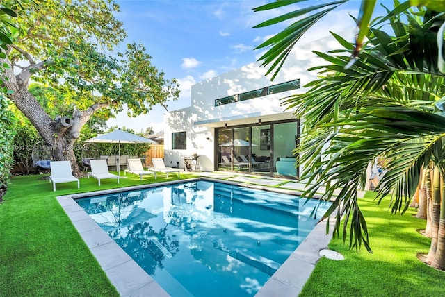 view of pool featuring a yard