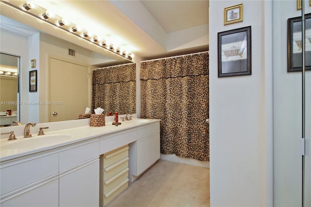 bathroom with vanity and a shower with shower curtain