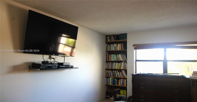 interior space with a textured ceiling