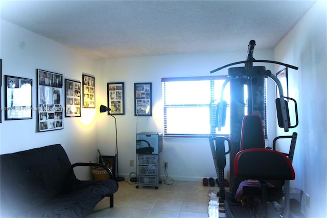 living area featuring a textured ceiling and ceiling fan