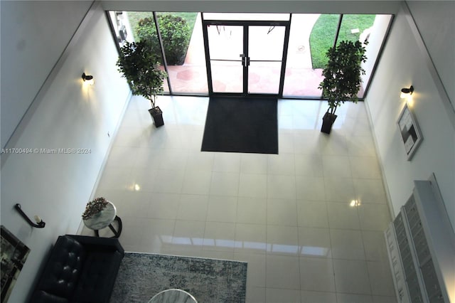 tiled living room with a healthy amount of sunlight