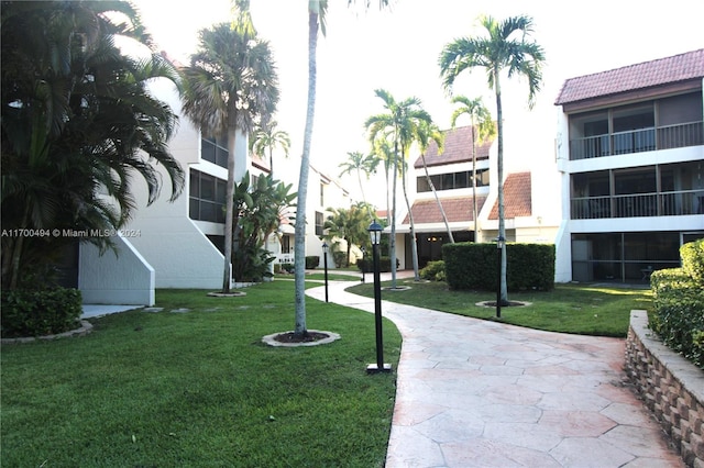 view of property's community with a yard