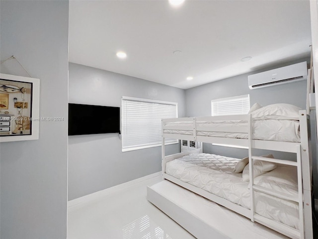 bedroom with a wall mounted AC