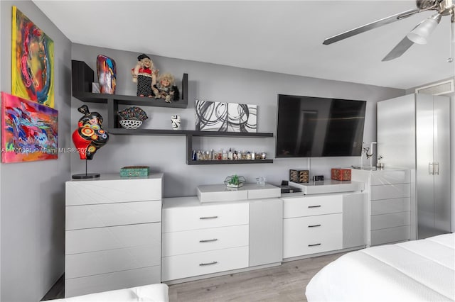 bedroom featuring light hardwood / wood-style floors and ceiling fan