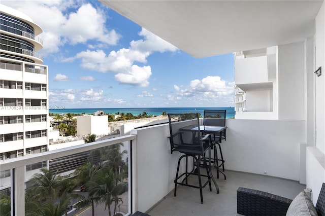 balcony featuring a water view