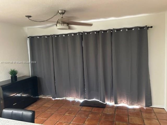 living room with dark tile patterned flooring