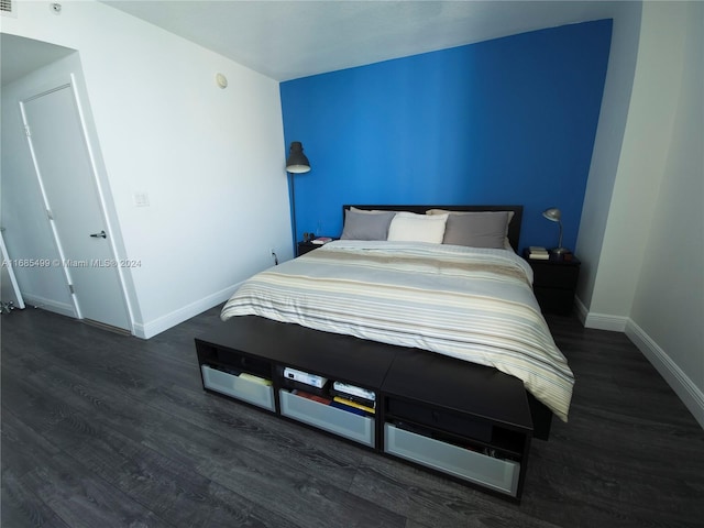 bedroom featuring dark wood-type flooring