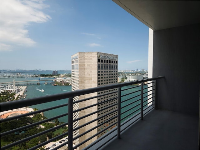 balcony featuring a water view